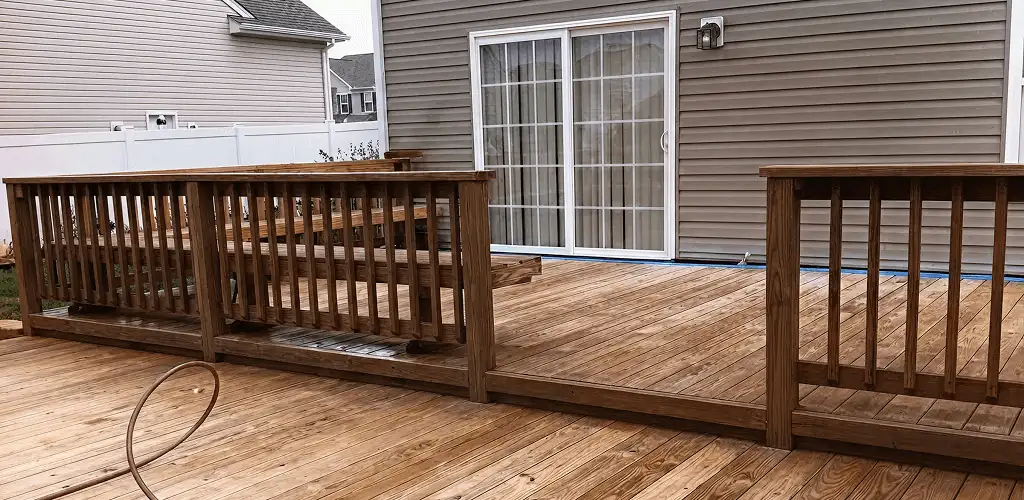 Deck sealing service protecting a backyard wood deck and railings in Naperville, IL