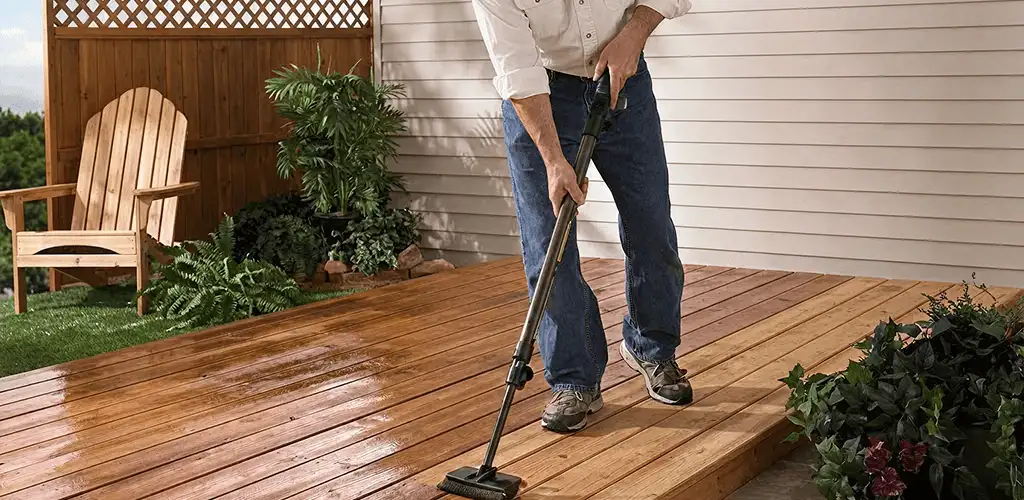 Deck staining service applying stain to a backyard wood deck in Naperville, IL